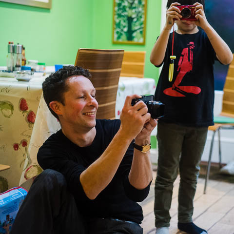 Ben Heasman photographing a family at home